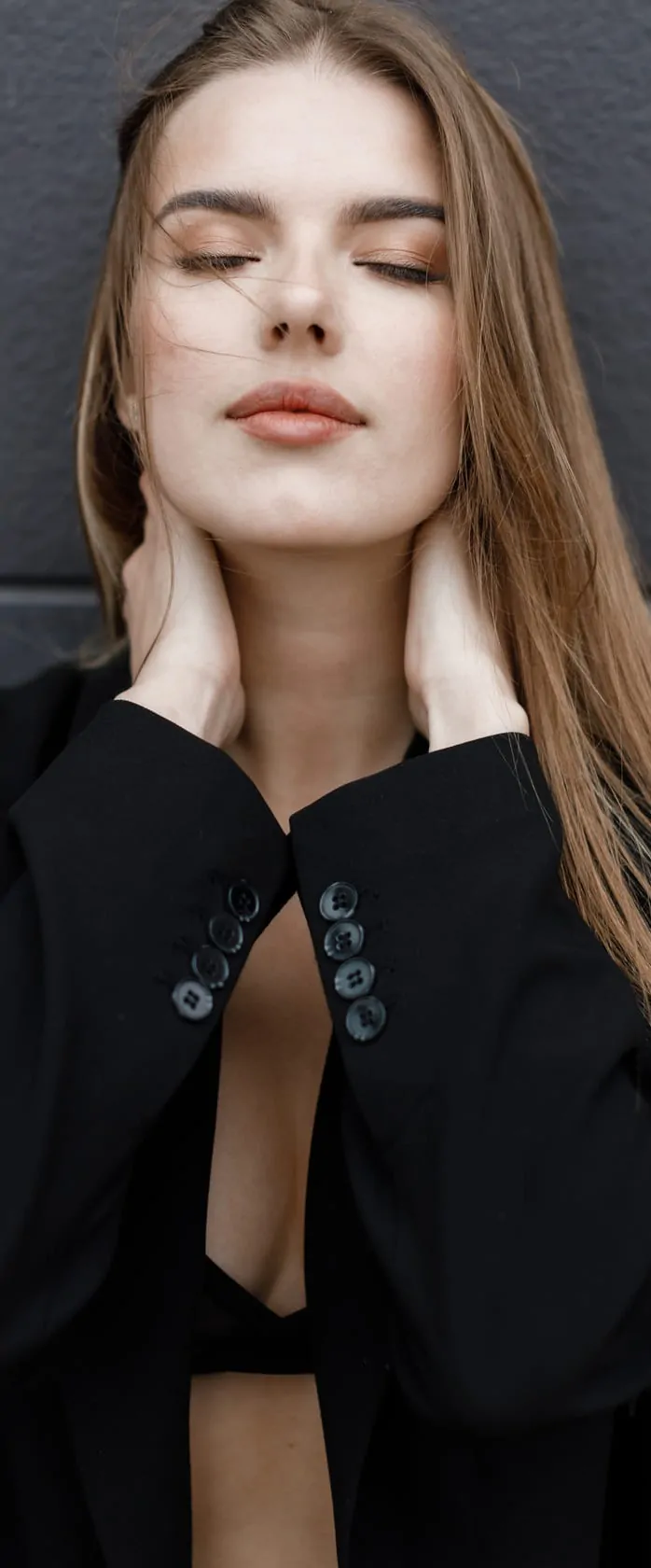 women holding her neck after getting surgery