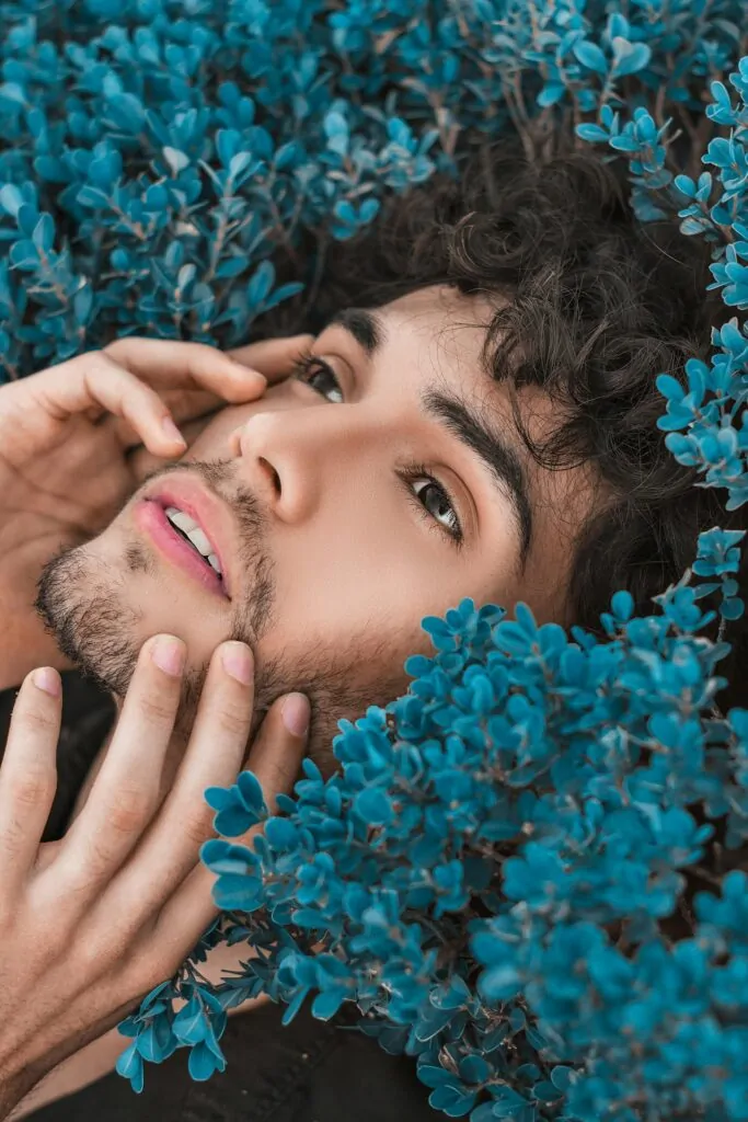 man flexing his handsome face after undergoing cosmetic surgery