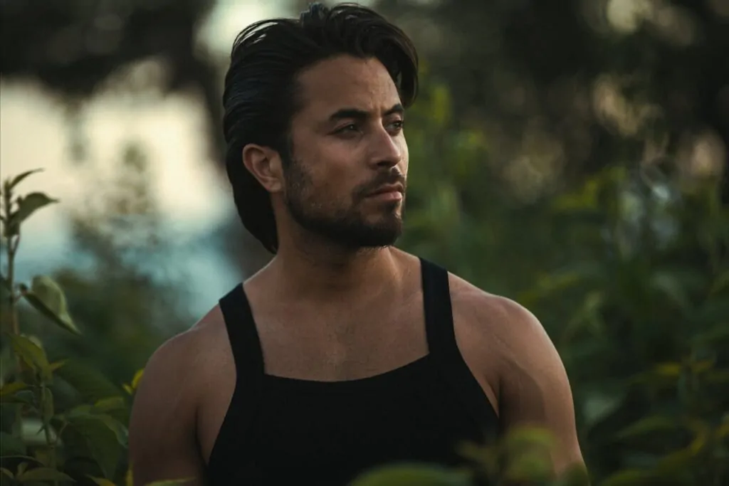 man posing by the field after his aesthetic surgery