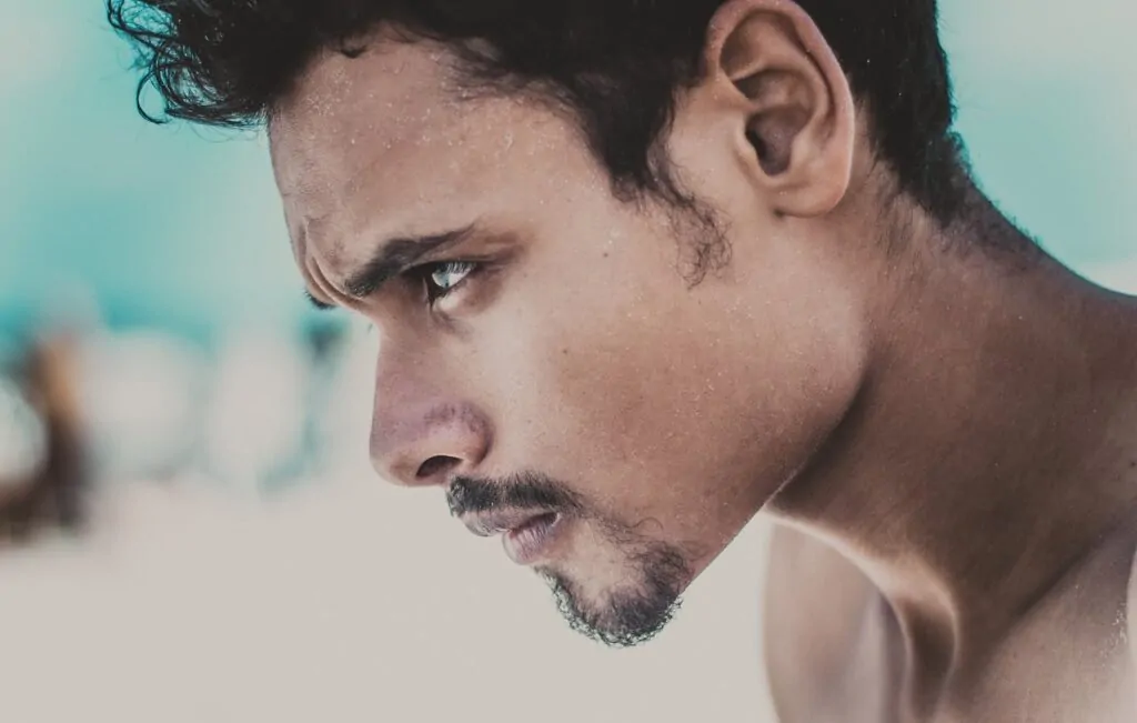 A man with a chiseled jaw after FaceTite procedure