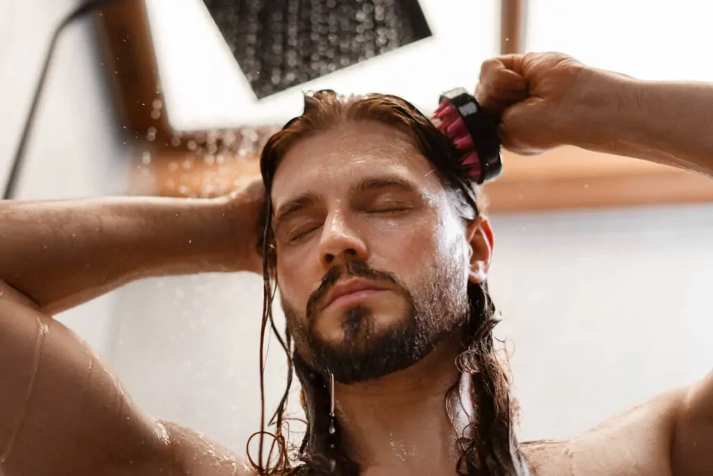 Man taking shower after getting PDO threads