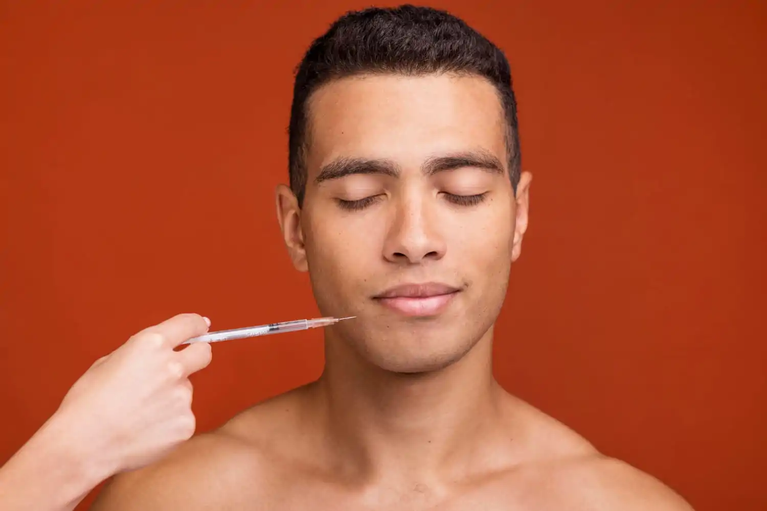Front view young male getting jawline fillers