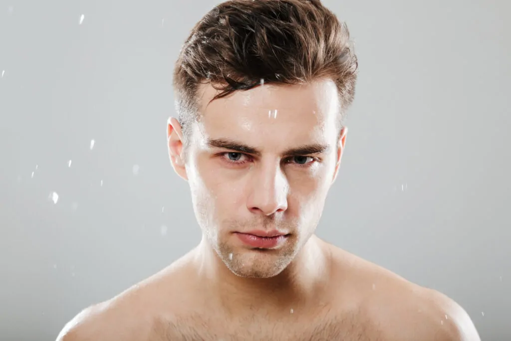 Close up portrait of a handsome half naked man
