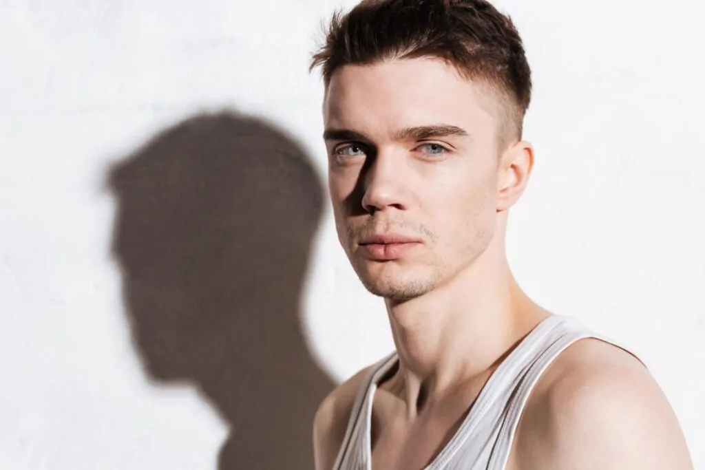 Man with defined facial features and strong jawline profile illustrating potential results of dermal filler jaw enhancement