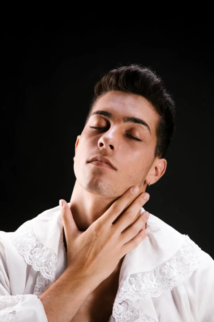 Tender male in shirt caressing neck