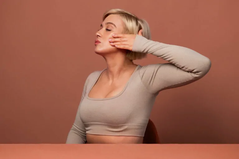 Woman showcasing smooth neck and jawline after non-surgical neck lift treatment