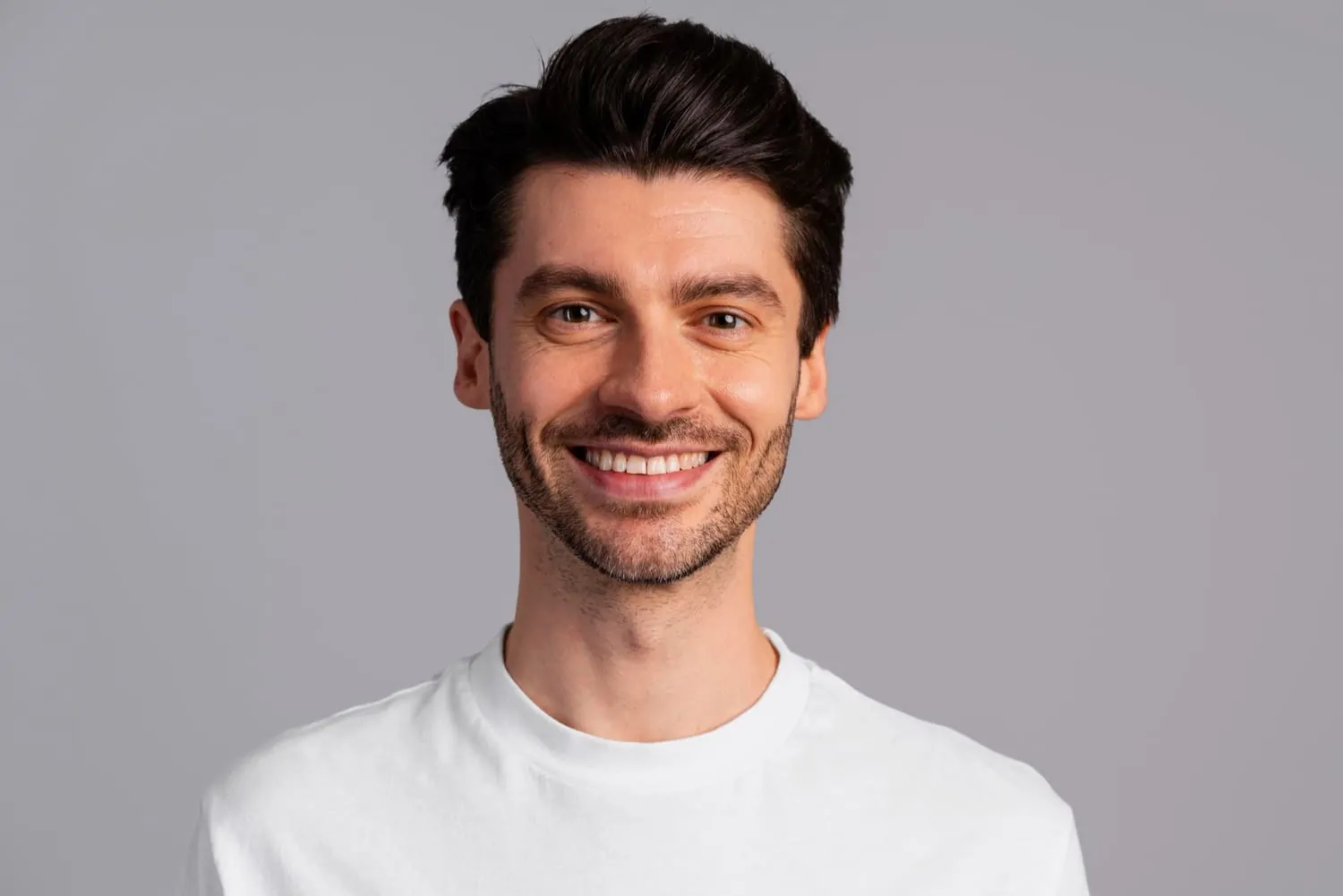 Front view of smiley handsome man for FaceTite