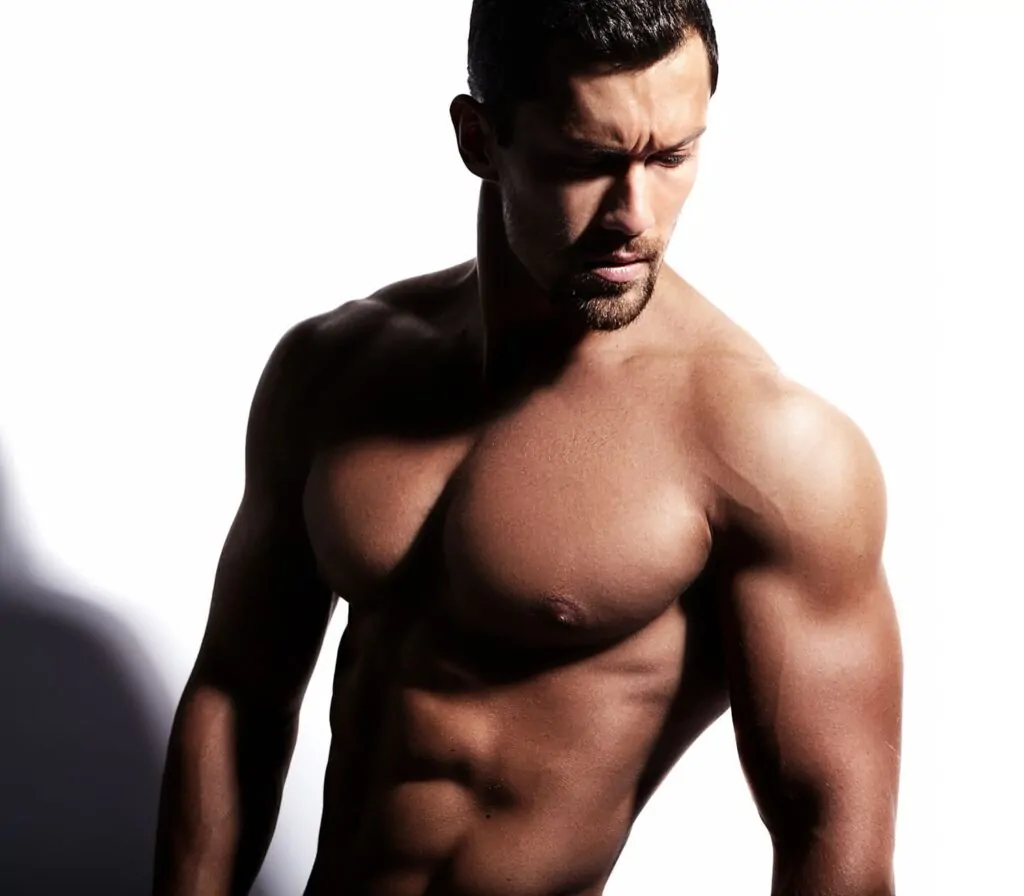 Strong shirtless man posing result to liposuction