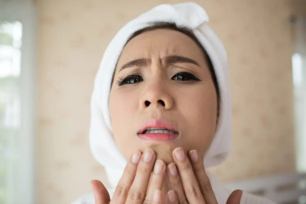 Woman checking her Swollen face After PDO Threads