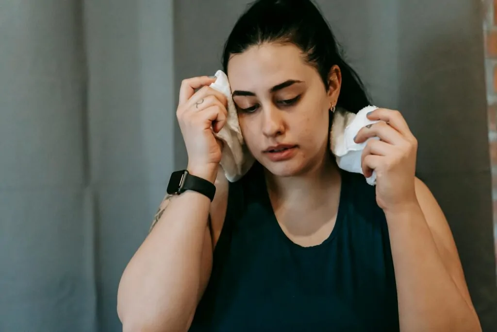 Woman struggling with excessive face sweat before Botox treatment