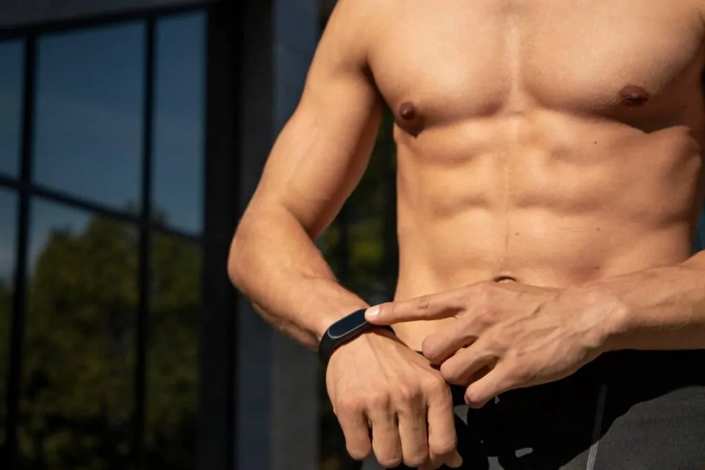 Close-up shot of sculpted abs after tummy tuck recovery