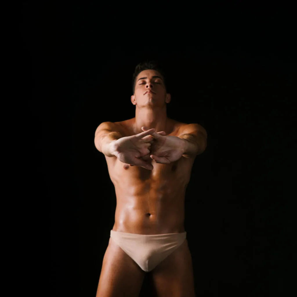 Front-facing view of male physique demonstrating body contours evaluated by highly rated plastic surgeons