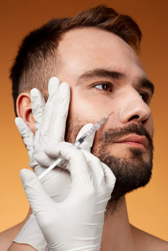 Portrait of man receiving enhancements and tweakments through the help of cosmetic procedures