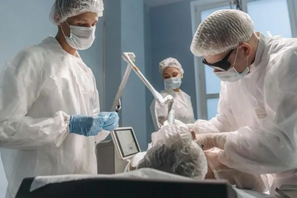 A team of surgeons performing plastic surgery