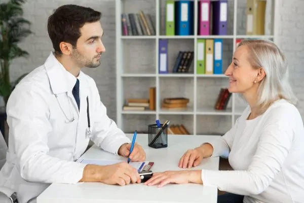 Woman consulting to a plastic surgeon about HGH