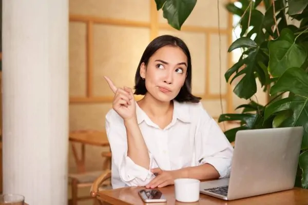Woman researching on a laptop if peptides are safe