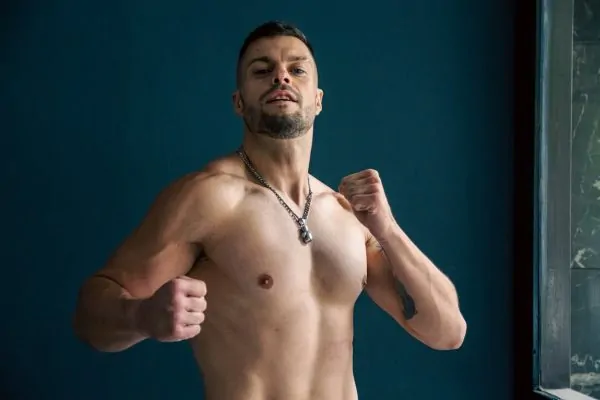 A man with sculpted abs after a lipo surgery