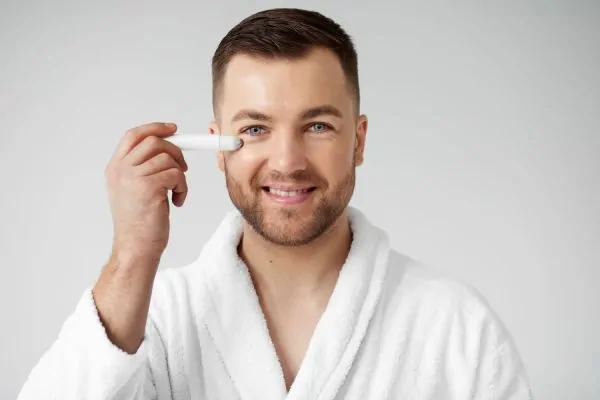man applying his anti aging treatment