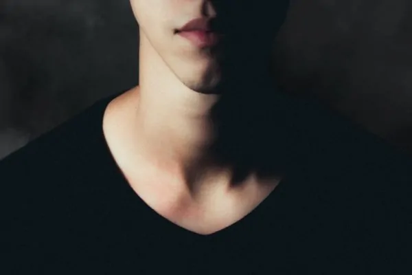 A man showing off his neck after having his turkey neck removed