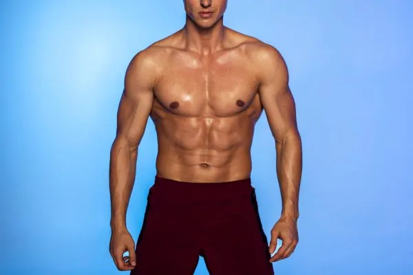 Close up fit man posing after tummy tuck
