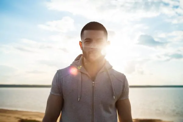 Man avoiding sunlight after getting plastic surgery