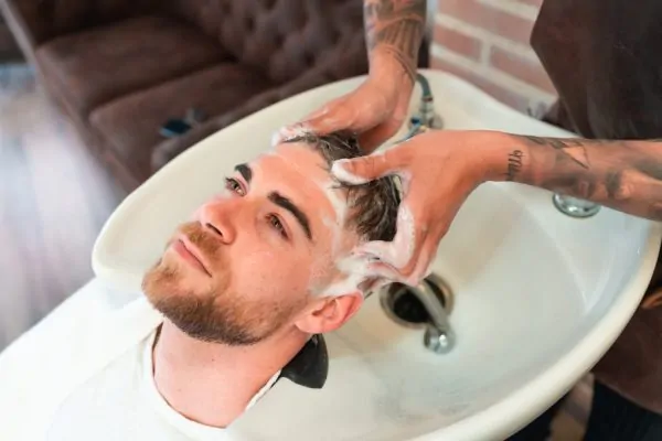 Man getting his hair washed after PDO thread lift