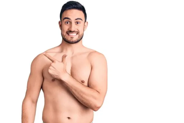 Man posing happily before undergoing full body liposuction