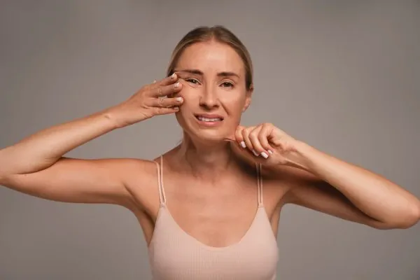 Woman feeling scared of getting jowls after losing weight