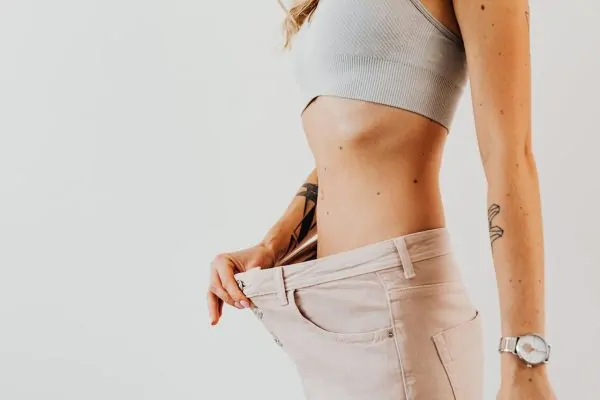 A person who has lost a significant weight after liposuction