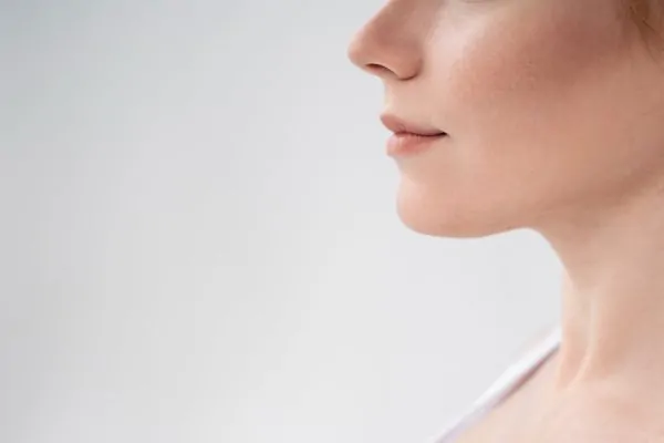 Close-up shot of person who had their jowls removed via dermal fillers