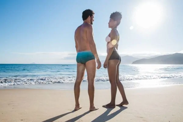Couple at the beach flexing their body after BBL