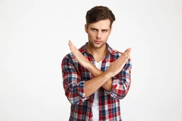 Man doing an X or no pose about neck liposuction recovery