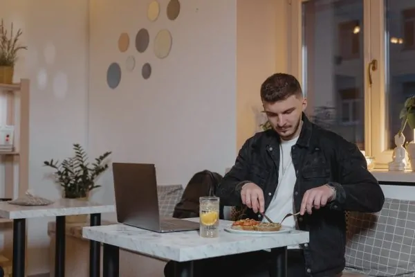 Man eating a healthy meal during his liposuction recovery phase