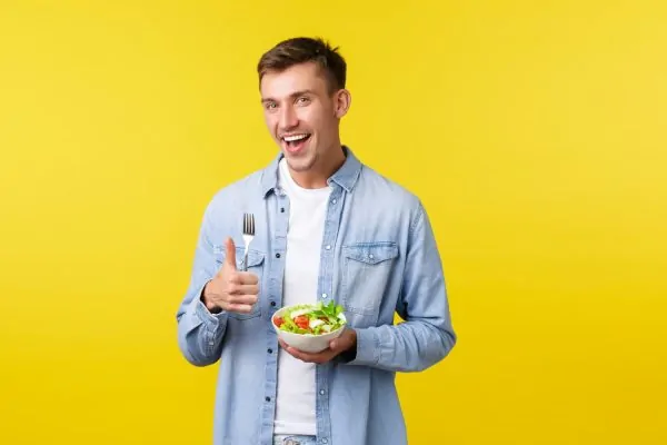 Man holding a nutritious meal after getting a PDO thread lift