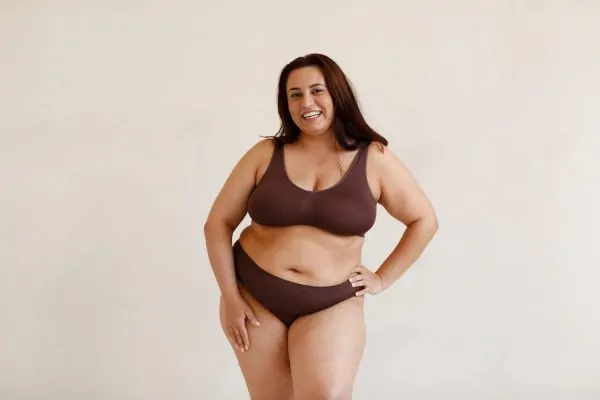Medium shot plus size model before having liposuction procedure