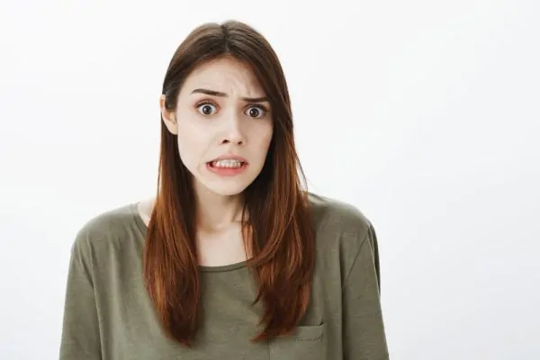 Worried reaction of a woman after hearing PDO thread lift risks