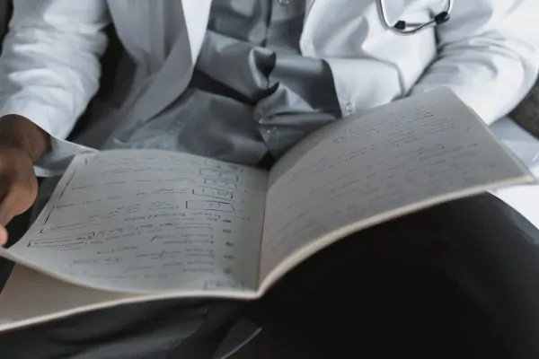 A close-up shot of a plastic surgeons notes before doing a surgery