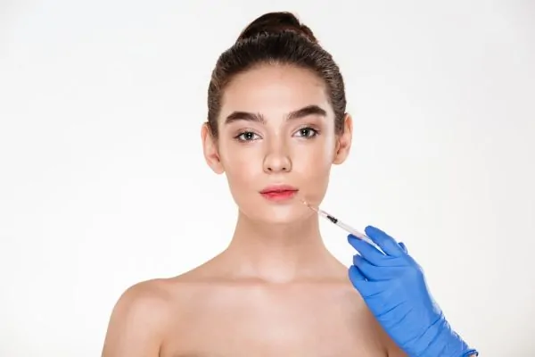Beautiful woman posing before getting Botox injections