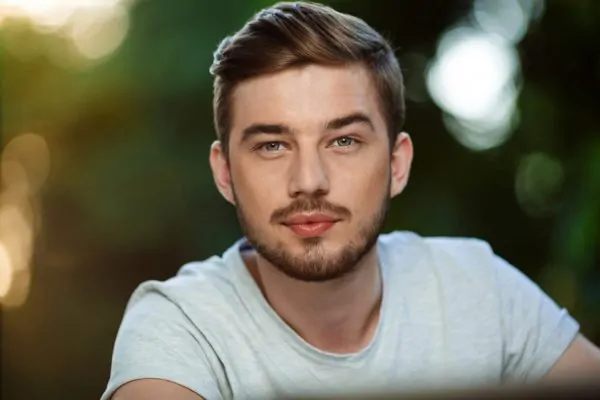 Close up portrait of a handsome man after getting PDO threads