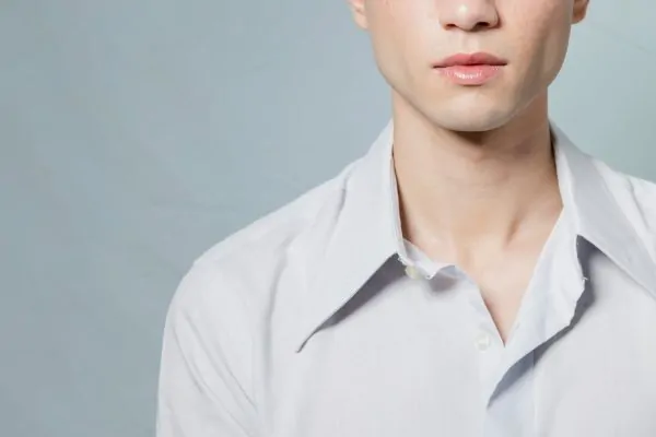 Close-up shot of a man's sharp jaw after fillers