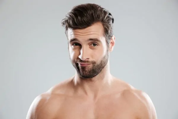 Close-up shot of handsome man's face after neck liposuction