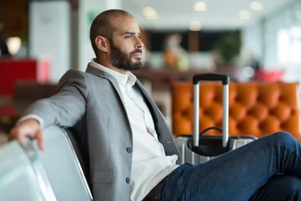 Man after Botox recovery getting ready for flying at the airport