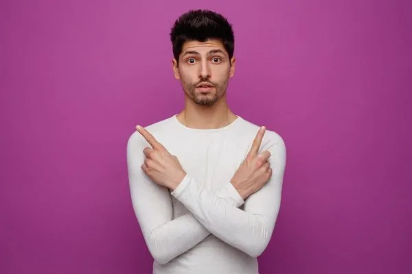 Man holding his fingers up after knowing the pros and cons of Botox