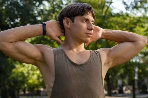 Man showing how Botox treated his excessive underarm sweating condition
