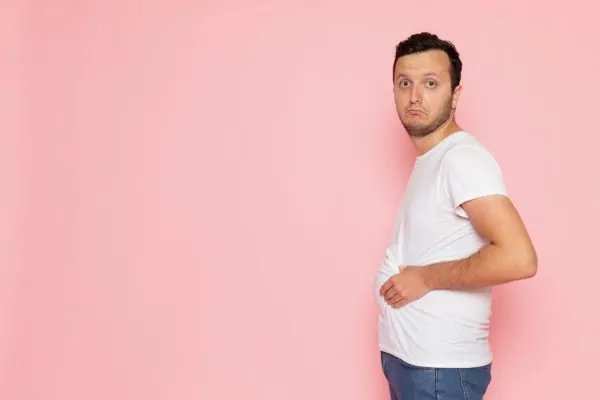 Man with big belly and thinking of getting another tummy tuck