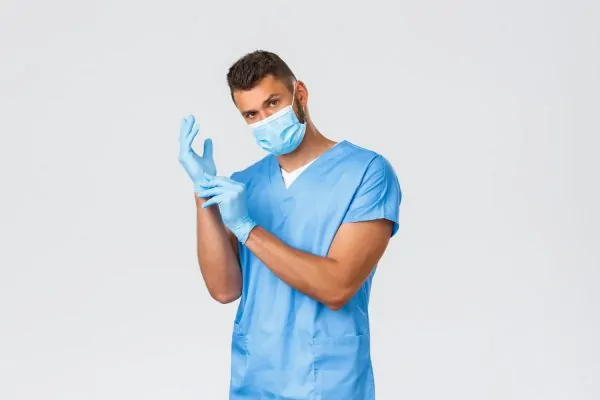 Plastic surgeon prepping for tummy tuck procedure