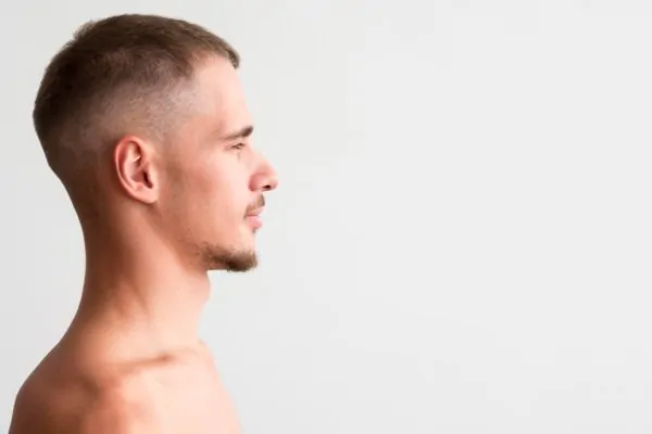 Side profile of a man after having a chin reduction surgery