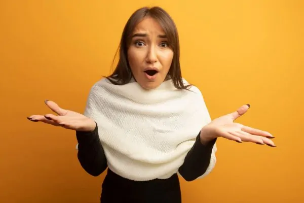 A woman looking surprised and overwhelmed, reflecting the uncertainty of what to expect before breast reconstructive surgery