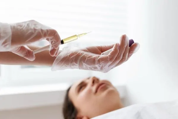Doctor administering peptide treatment highlighting the importance of medical supervision for safe use