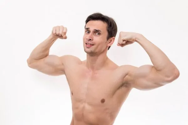 Man flexing both arms showing toned biceps and lean torso against white background
